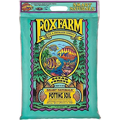 A bag of FoxFarm Ocean Forest potting soil, featuring a colorful label with images of plants and the brand logo.